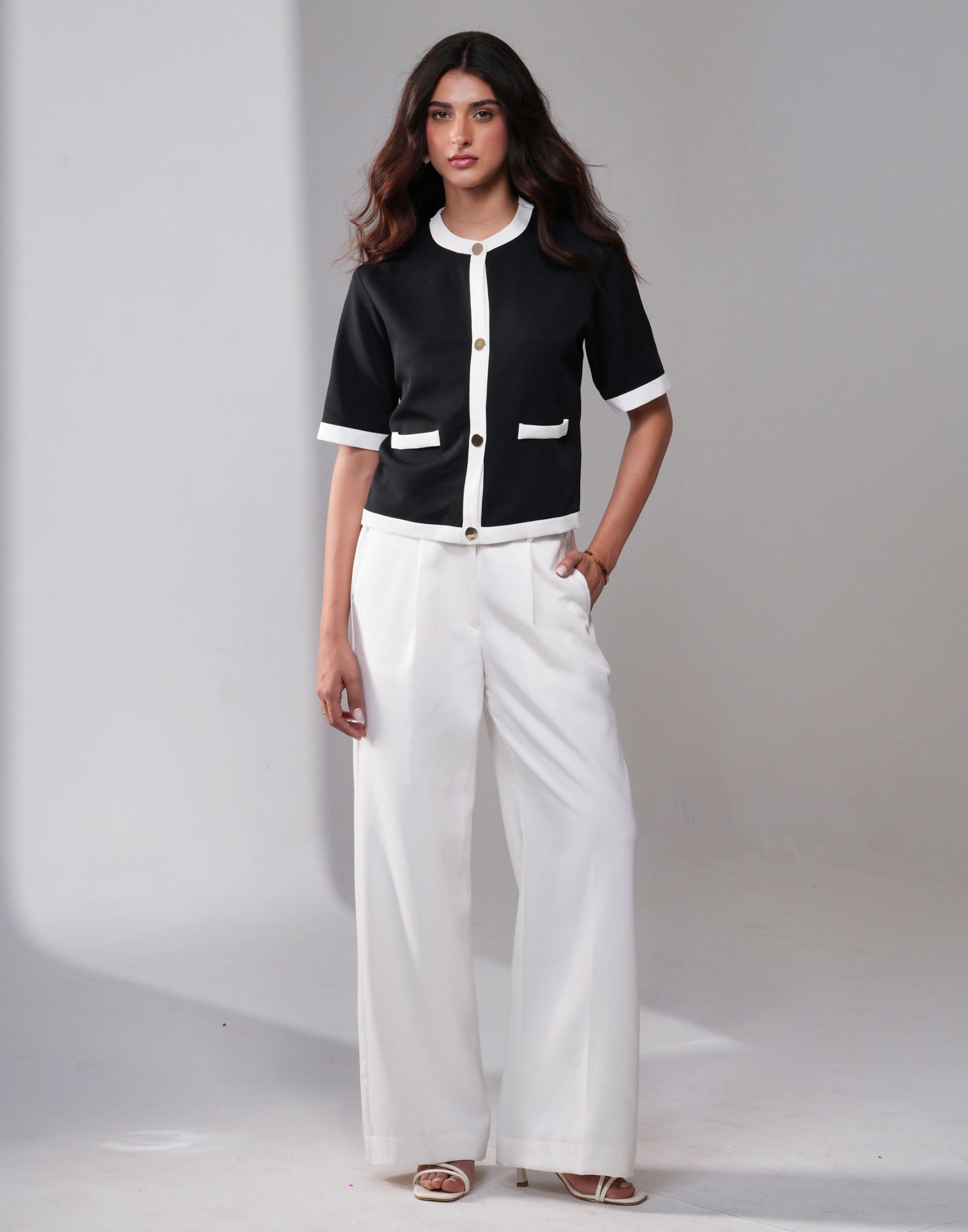 Urban Nomad Monochrome Co-ord Set — front view of black top with contrast white straps and white pants